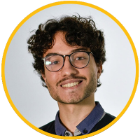 Smiling young man with curly hair, glasses and light mustache, headshot in yellow circular frame